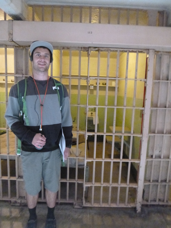 Antony standing in front of one of the cells